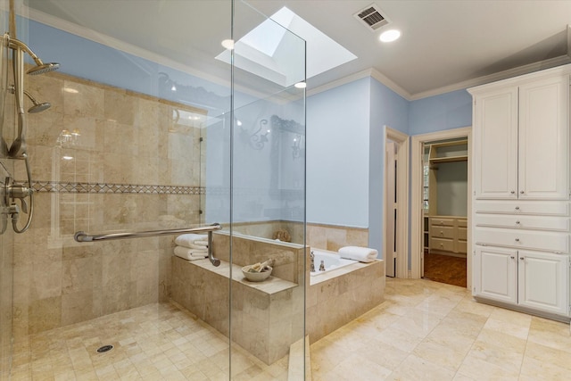 bathroom with a skylight, a shower stall, visible vents, and crown molding