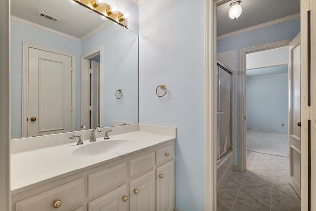 full bathroom featuring shower / bath combination with glass door, crown molding, visible vents, vanity, and tile patterned flooring