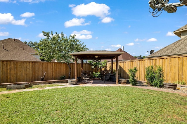 view of yard with a fenced backyard, a patio, and a gazebo