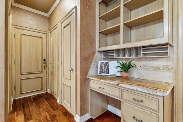 hallway featuring baseboards, ornamental molding, and dark wood-style flooring