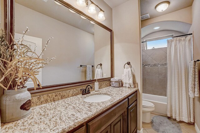 full bathroom featuring shower / tub combo with curtain, toilet, tile patterned floors, and vanity