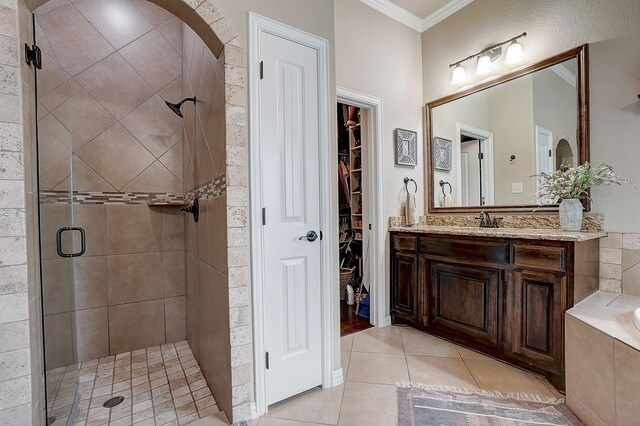 bathroom with tile patterned floors, vanity, separate shower and tub, and crown molding