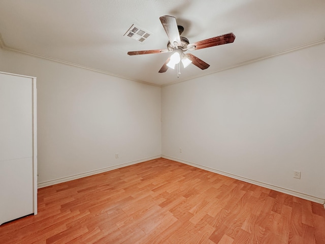 unfurnished room featuring light hardwood / wood-style floors, ceiling fan, and ornamental molding