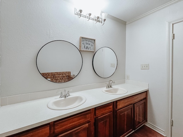 bathroom featuring vanity and ornamental molding