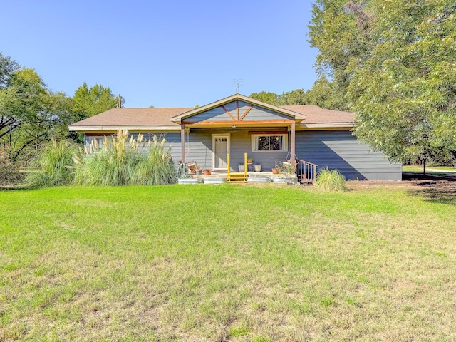 view of front of property with a front yard and a porch