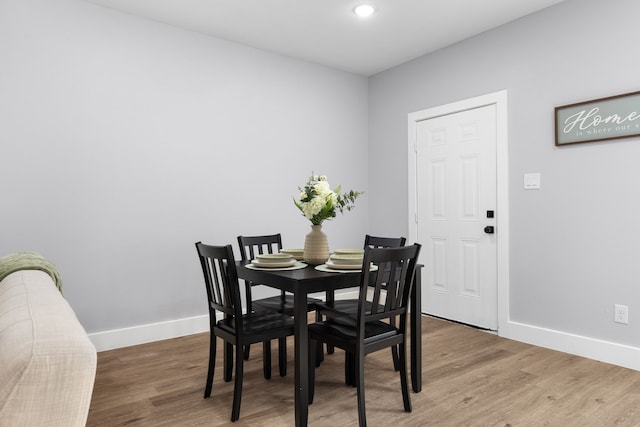 dining area with wood-type flooring