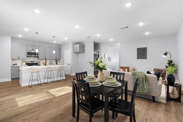 dining room featuring light hardwood / wood-style floors