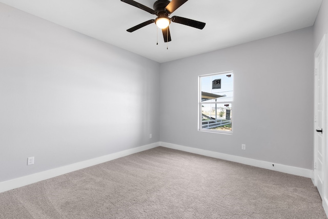 unfurnished room featuring ceiling fan and light carpet