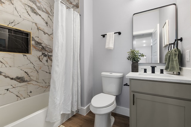 full bathroom featuring hardwood / wood-style floors, shower / bath combo, vanity, and toilet