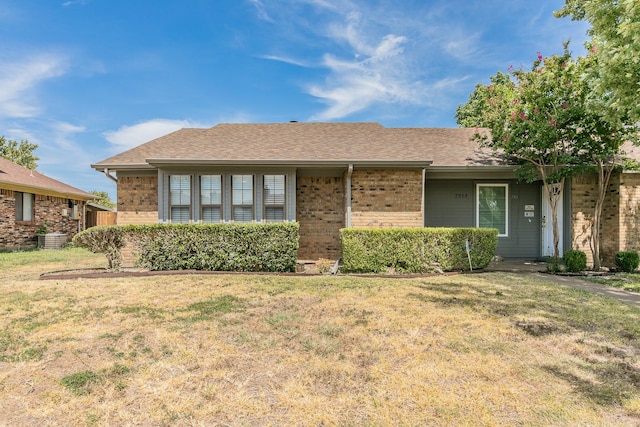 ranch-style home with a front lawn