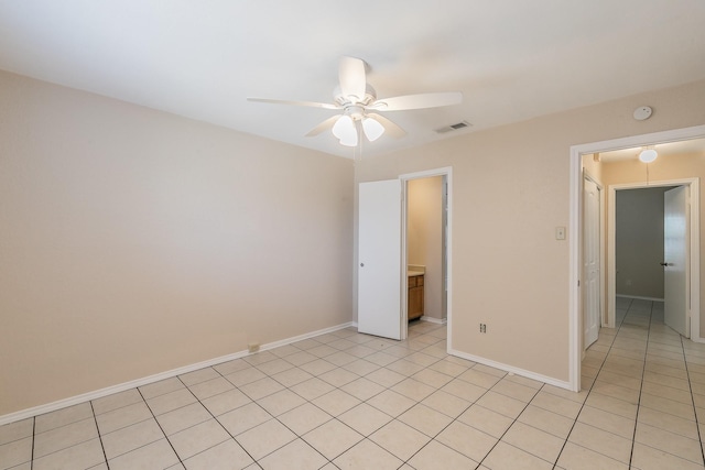 unfurnished bedroom featuring light tile patterned floors and ceiling fan