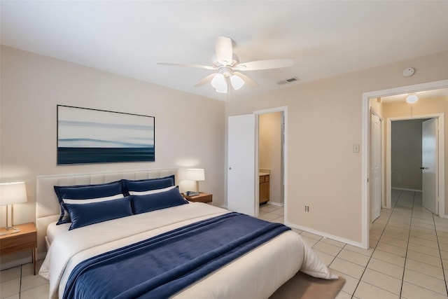 bedroom with ceiling fan and light tile patterned floors