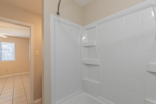 bathroom featuring tiled shower / bath and tile patterned flooring