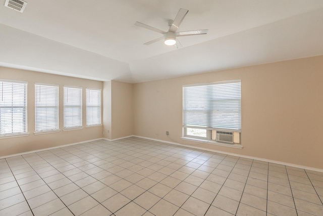 spare room with cooling unit, plenty of natural light, ceiling fan, and vaulted ceiling