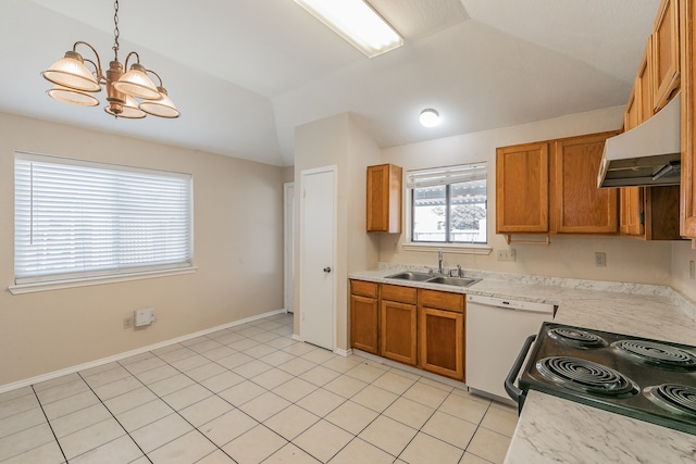 kitchen with sink, pendant lighting, wall chimney range hood, light tile patterned floors, and white dishwasher