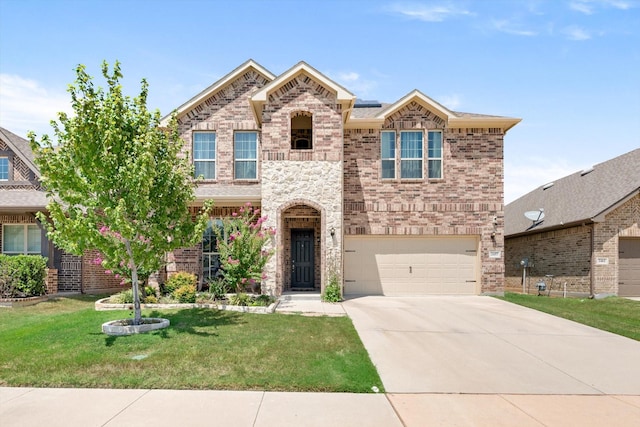 view of front of house with a garage and a front yard