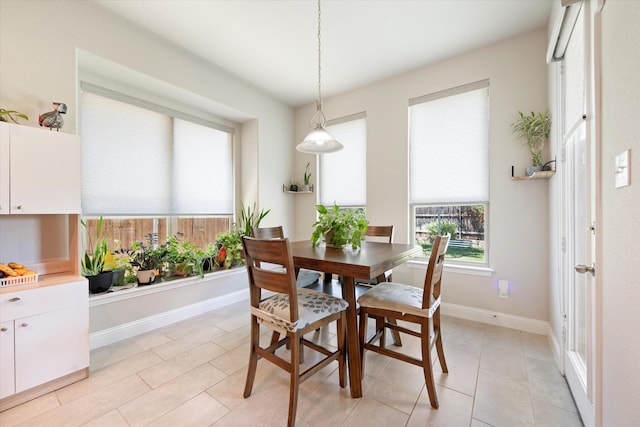 dining area with light tile patterned flooring