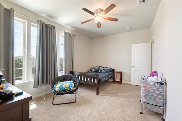 bedroom featuring light carpet and ceiling fan