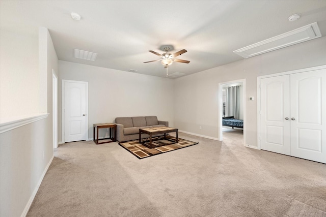 living room featuring light carpet and ceiling fan