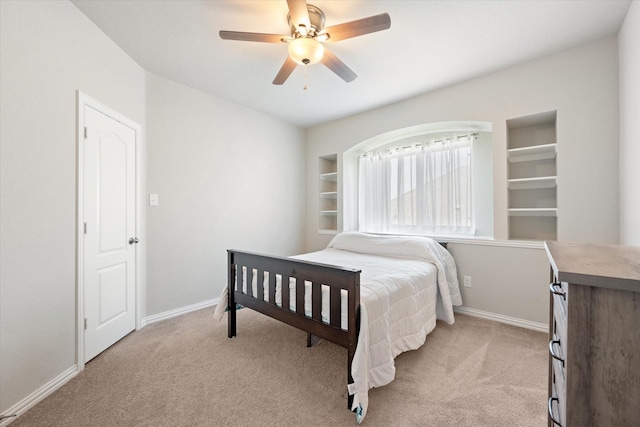 bedroom featuring light colored carpet and ceiling fan