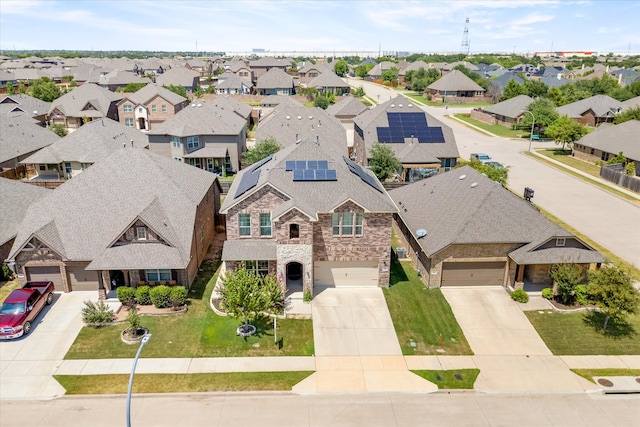 view of front of property featuring a garage and a yard