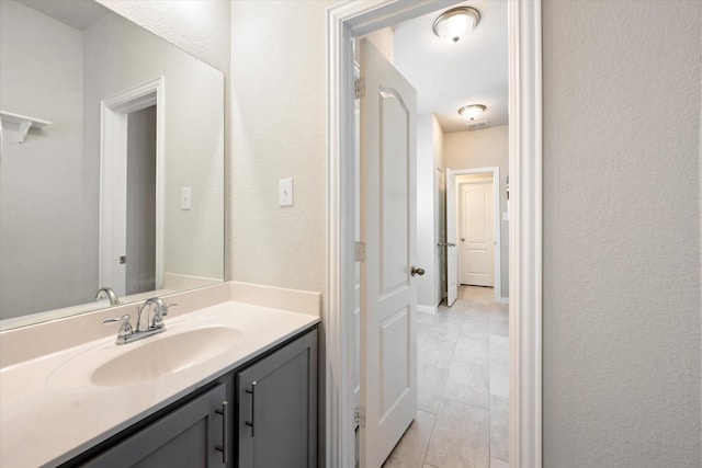 bathroom featuring vanity and tile patterned flooring