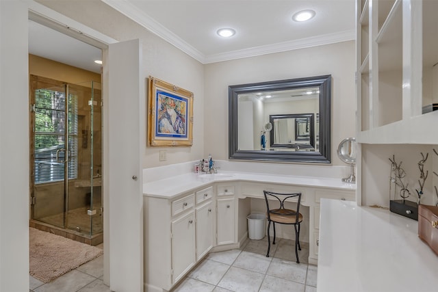 bathroom with a shower with shower door, vanity, crown molding, and tile patterned flooring