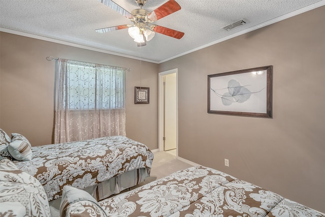 bedroom featuring a textured ceiling, ornamental molding, carpet flooring, and ceiling fan