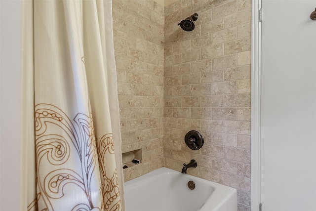 bathroom with shower / bath combination with curtain