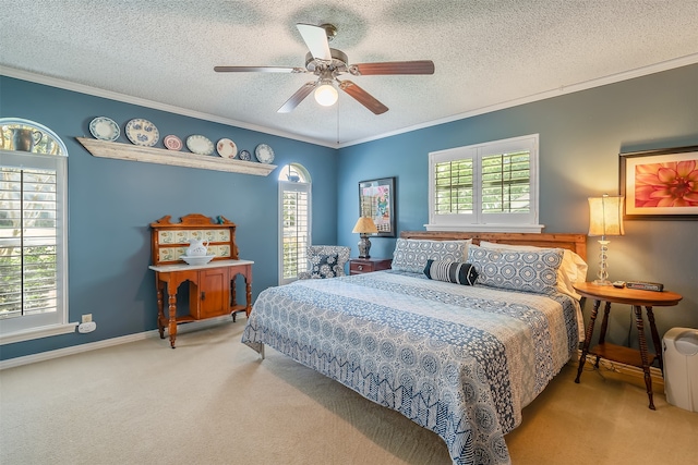 carpeted bedroom with ceiling fan, a textured ceiling, and multiple windows