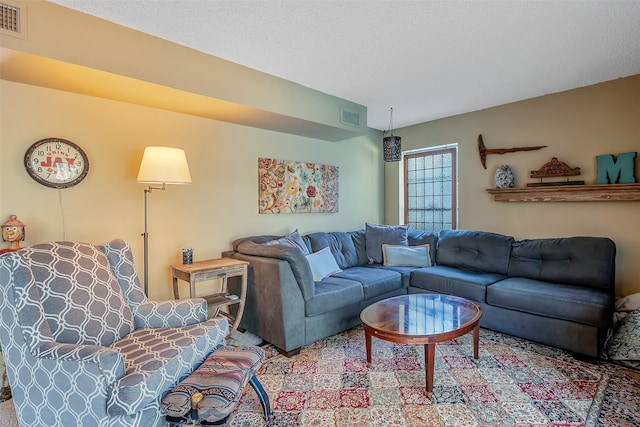 living room with a textured ceiling