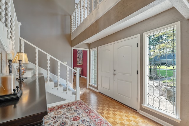 entryway with light parquet flooring