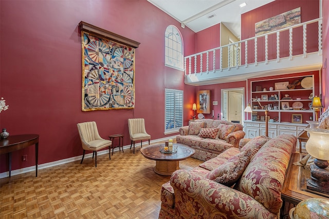 living room featuring parquet floors and a towering ceiling