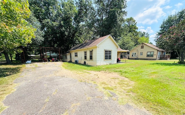 view of home's exterior with a yard