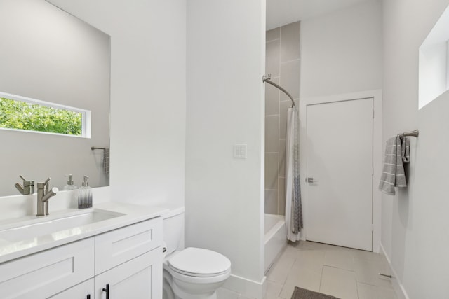 full bathroom featuring shower / bathtub combination with curtain, vanity, tile patterned floors, and toilet