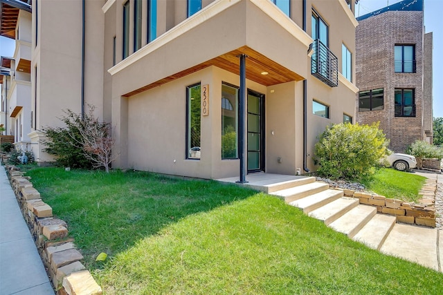 entrance to property with a yard