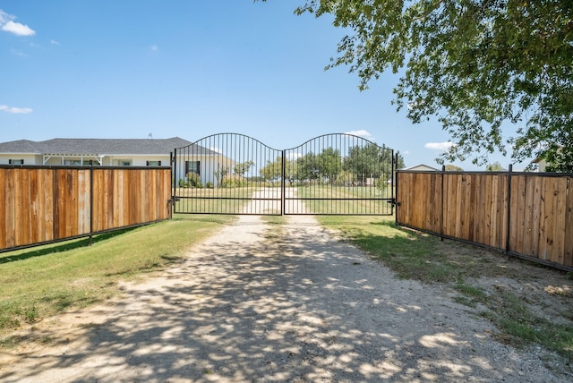 view of gate featuring fence