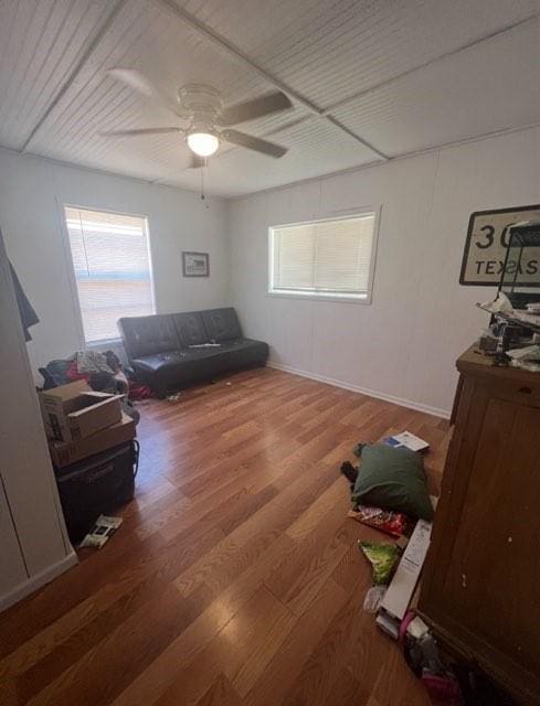 interior space featuring wood finished floors and a ceiling fan