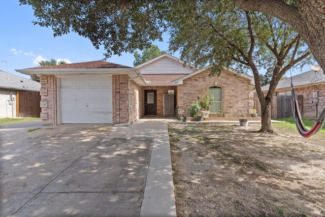 single story home featuring a garage