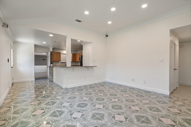 unfurnished living room with crown molding