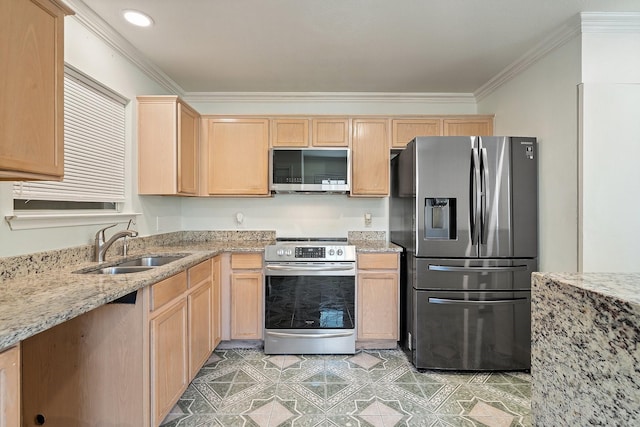 kitchen featuring light stone countertops, light brown cabinetry, stainless steel appliances, and sink