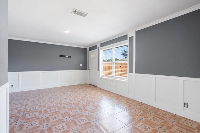 tiled empty room with crown molding