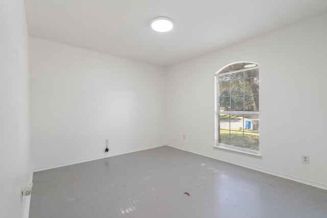 empty room featuring concrete flooring