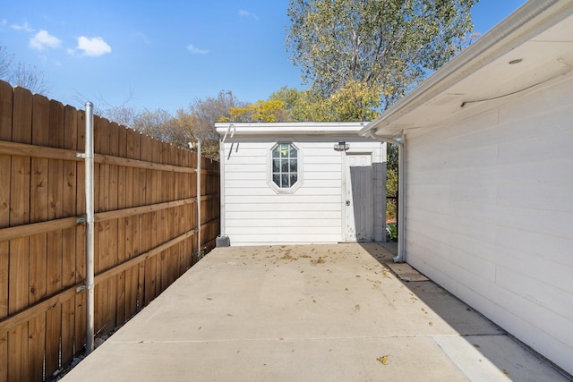 view of patio with a storage shed