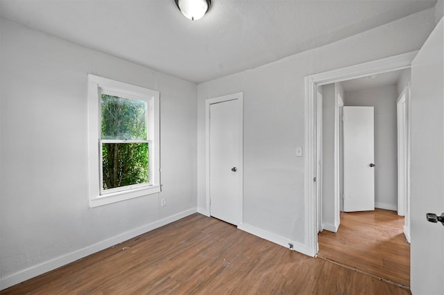 empty room with light hardwood / wood-style floors