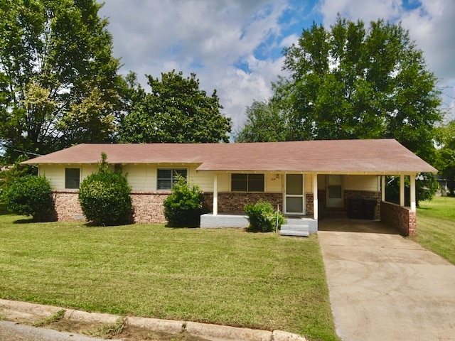 single story home with a front yard and a carport