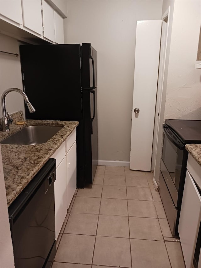 kitchen featuring sink, black appliances, white cabinets, and light stone countertops