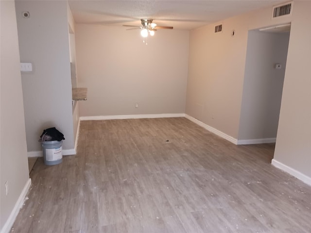 unfurnished living room featuring hardwood / wood-style floors and ceiling fan