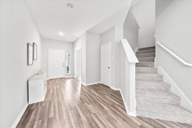 entryway with light hardwood / wood-style floors