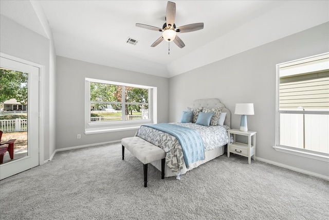 bedroom featuring light carpet, access to outside, and ceiling fan